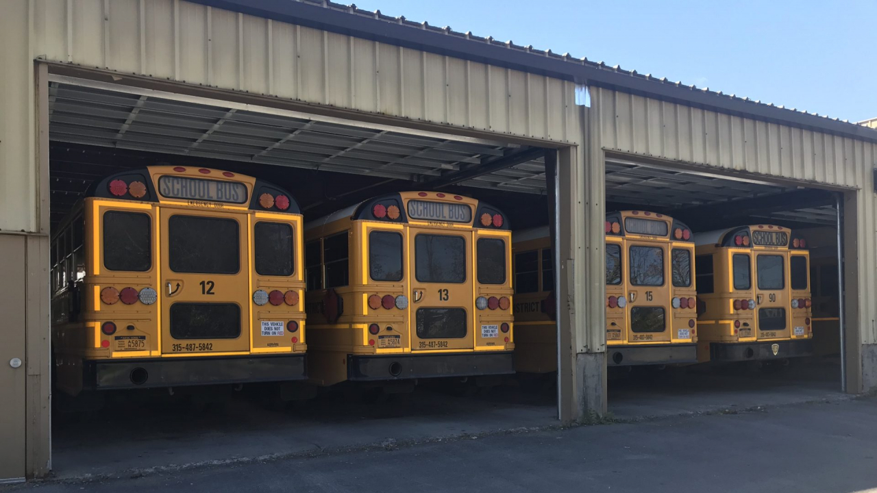School buses lined up ready to depart the garage