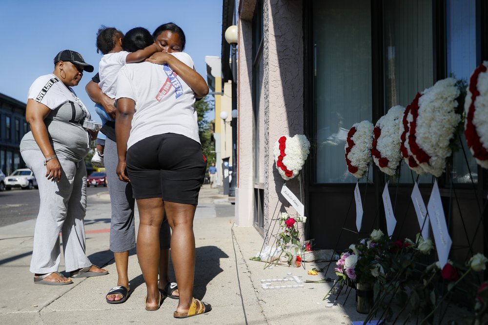 Family members of a shooting victim mourn the tragedy in Dayton, Ohio.