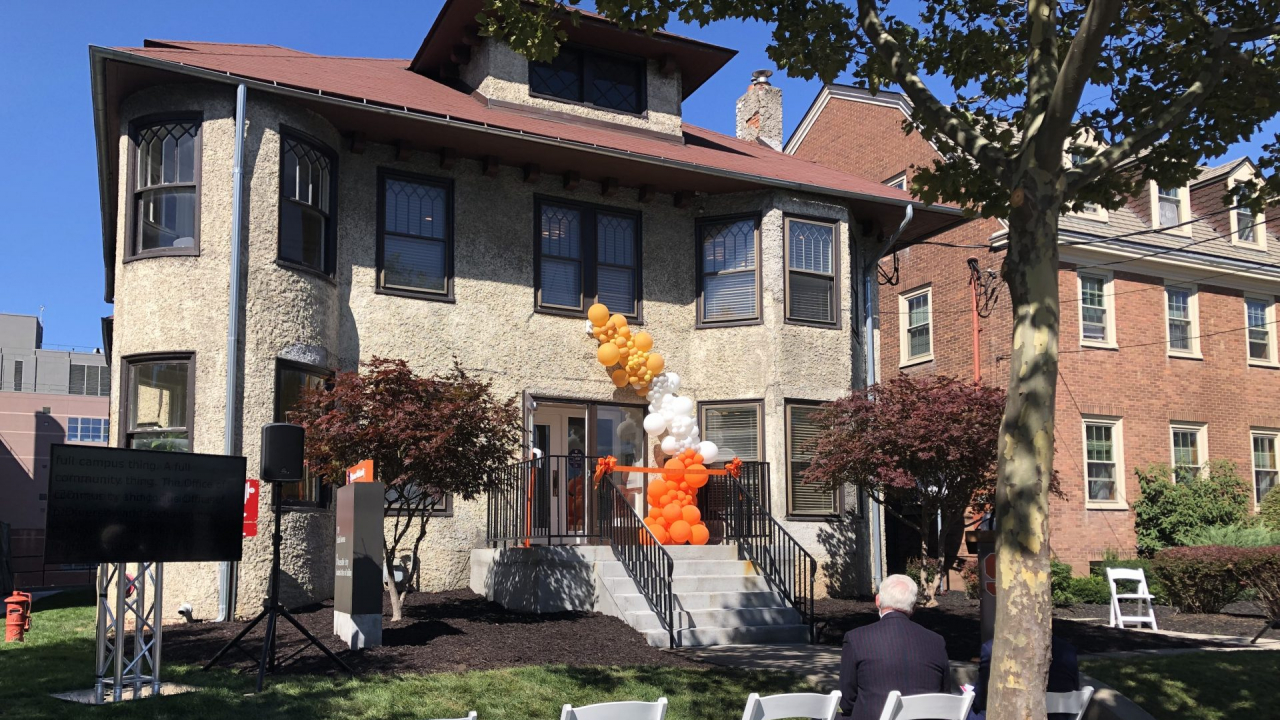 Outside of 119 Euclid with chairs, balloons, and ribbon for ribbon cutting ceremony