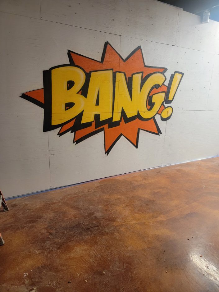 The word "bang" painted on the wall