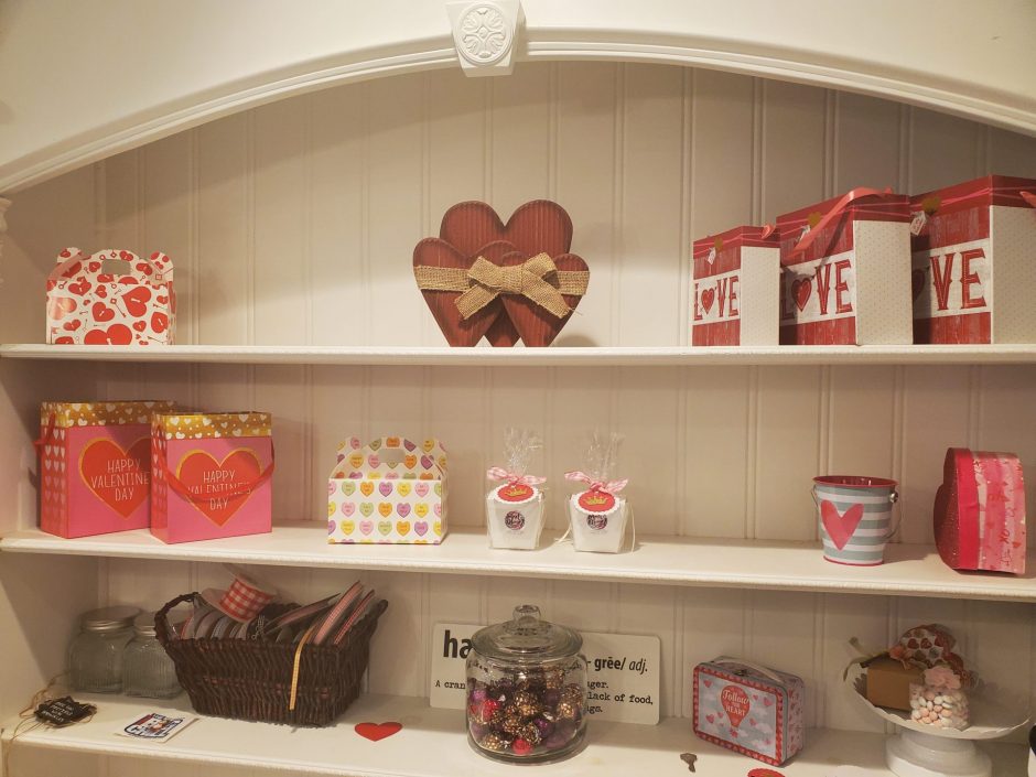 Valentine's Day selection of different boxes and bags hanging on the store shelfs
