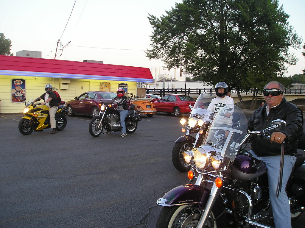 4 men riding 4 motorcycle