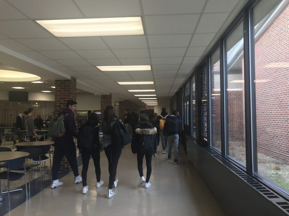 Students walk through the hallways on the way to class