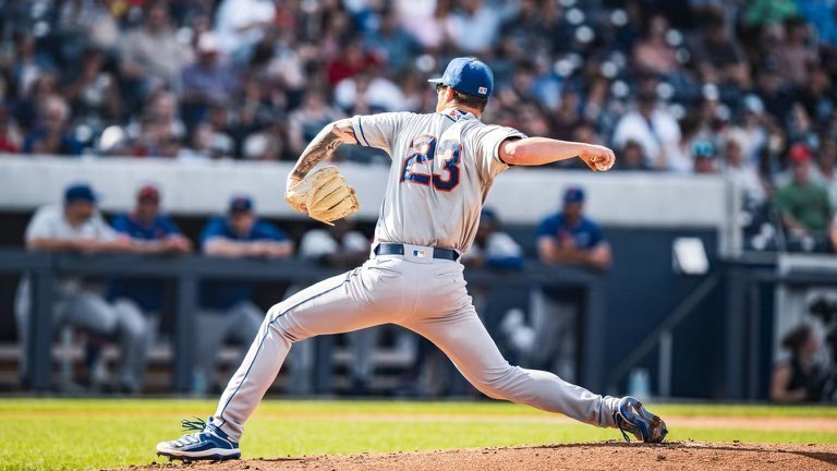 Adam Oller pitching for the Syracuse Mets