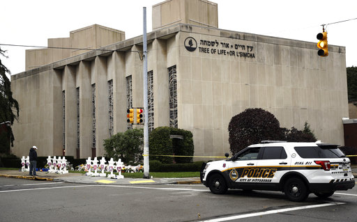A police vehicle is posted near the Tree of Life/Or L'Simcha Synagogue in Pittsburgh, Monday, Oct. 29, 2018. Tree of Life shooting suspect Robert Gregory Bowers is expected to appear in federal court Monday. Authorities say he expressed hatred toward Jews during the rampage Saturday morning and in later comments to police. (AP Photo/Matt Rourke)
