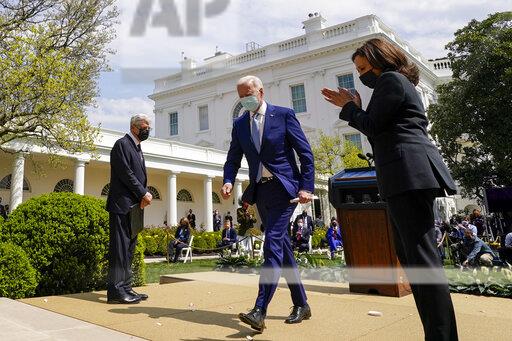 President Joe Biden, accompanied by Vice President Kamala Harris, right, and Attorney General Merrick Garland, left, departs after speaking about gun violence prevention in the Rose Garden at the White House, Thursday, April 8, 2021, in Washington. (AP Photo/Andrew Harnik)