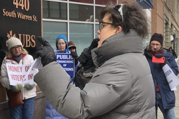 Dana Balter and others rally outside Rep. John Katko's office about bill HR-1
