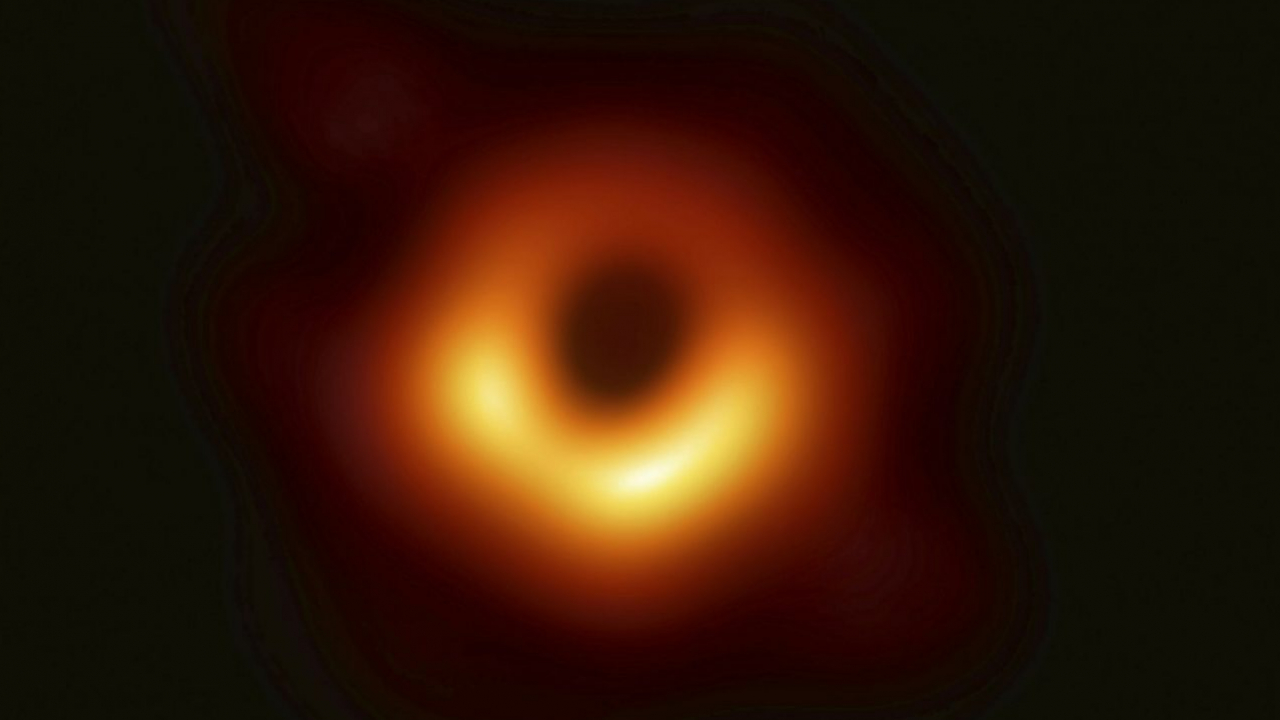 The first image of a black hole, released Wednesday, April 10. The image was made thanks to an algorithm created by computer scientist Katie Bouman