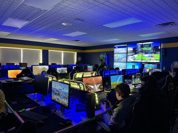 Students play video games in the eSports room at West Genesee High School