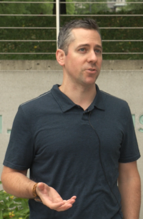 Chris Baker speaks with NCC News outside of the Newhouse School