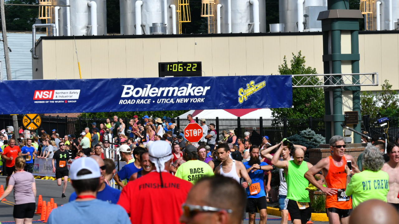 Runners cross the finish line at the 2019 Boilermaker. They continue down the street to the post-race party with live music, food and beer.