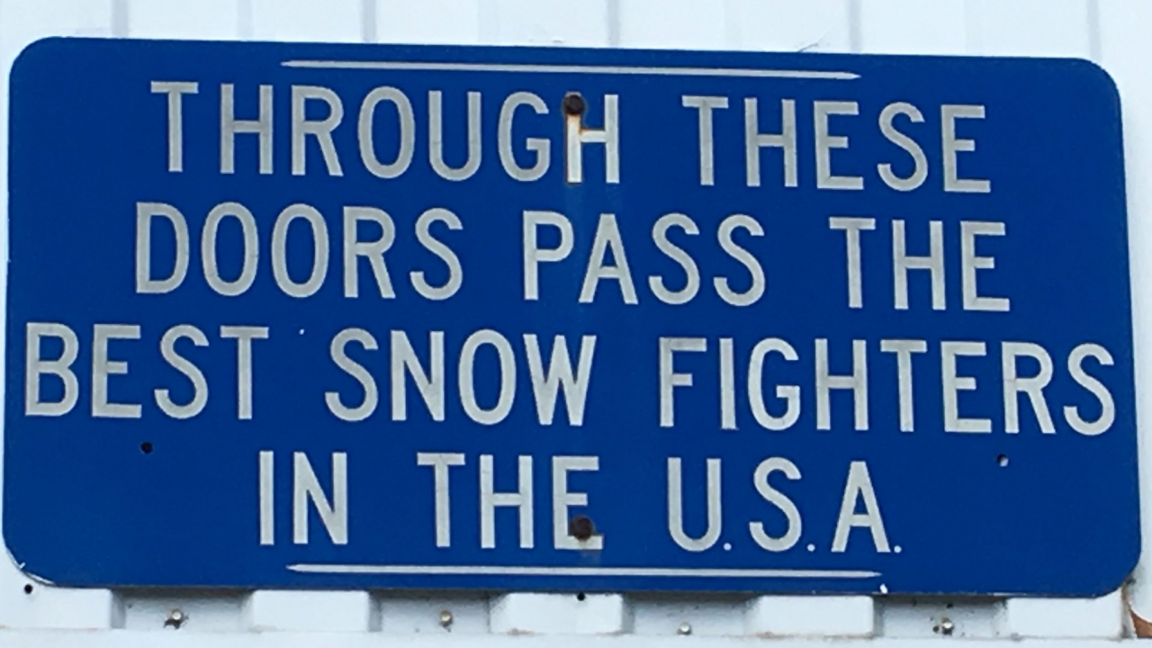 Sign near employee entrance at DPW