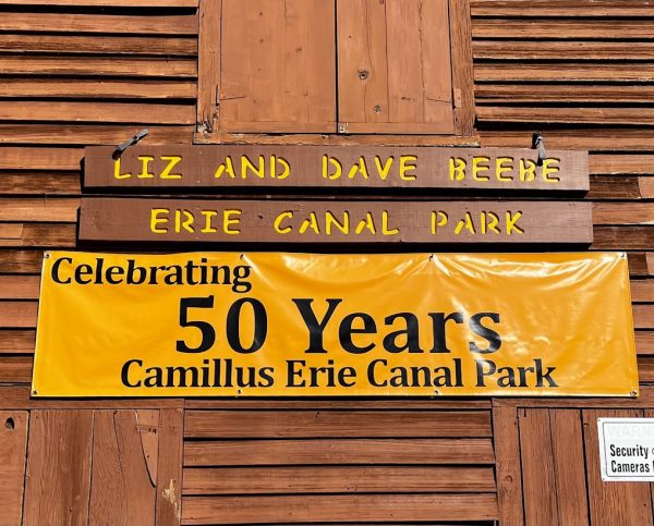 A banner commemorating the park's 50th anniversary is displayed on the side of the main building.