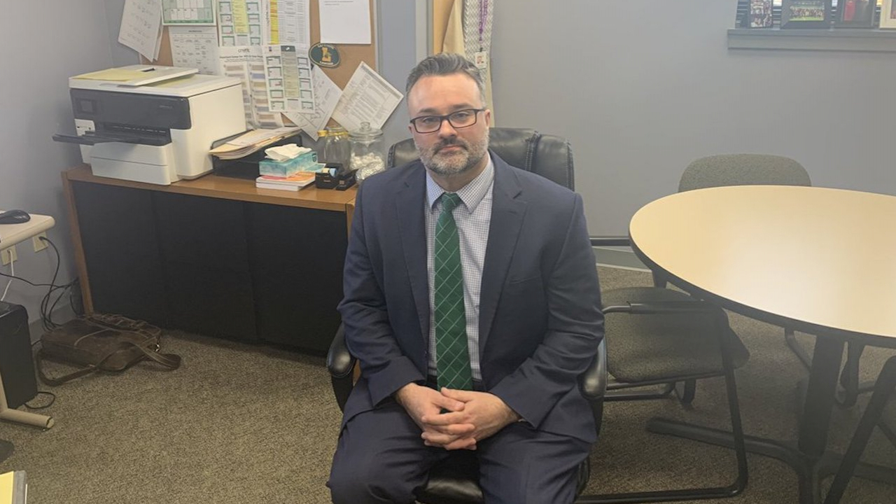 Lafayette Central School District Superintendent Jeremy Belfield sits in his office.