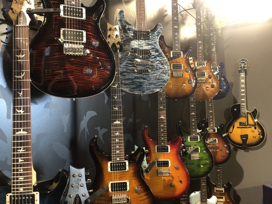 Guitars on wall in Ish Guitars.