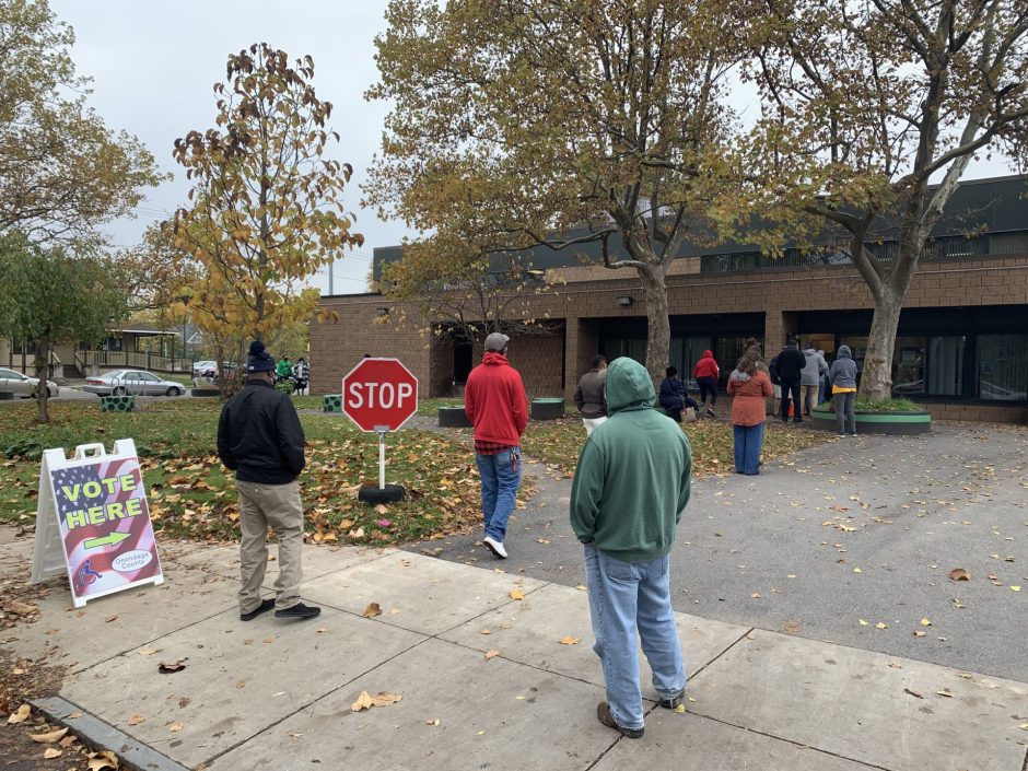 People line up right when the polling site opens to vote