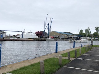 Parking lot, river, boats