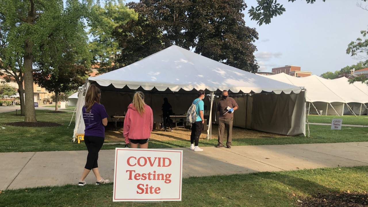 Students wait in line at the COVID testing site on the quad.