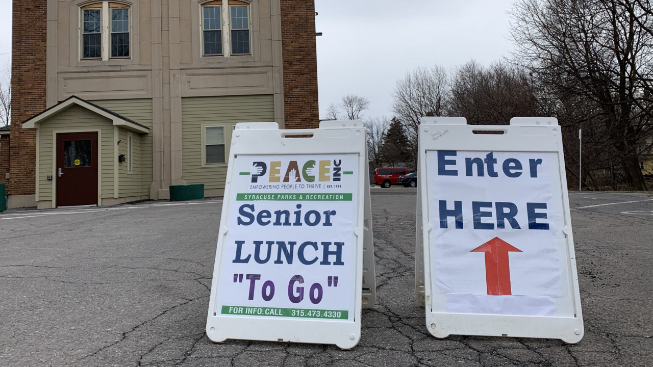 Signs in front of the the Bob Cecile Community Center, where the City of Syracuse is distributing lunches via drive-thru.
