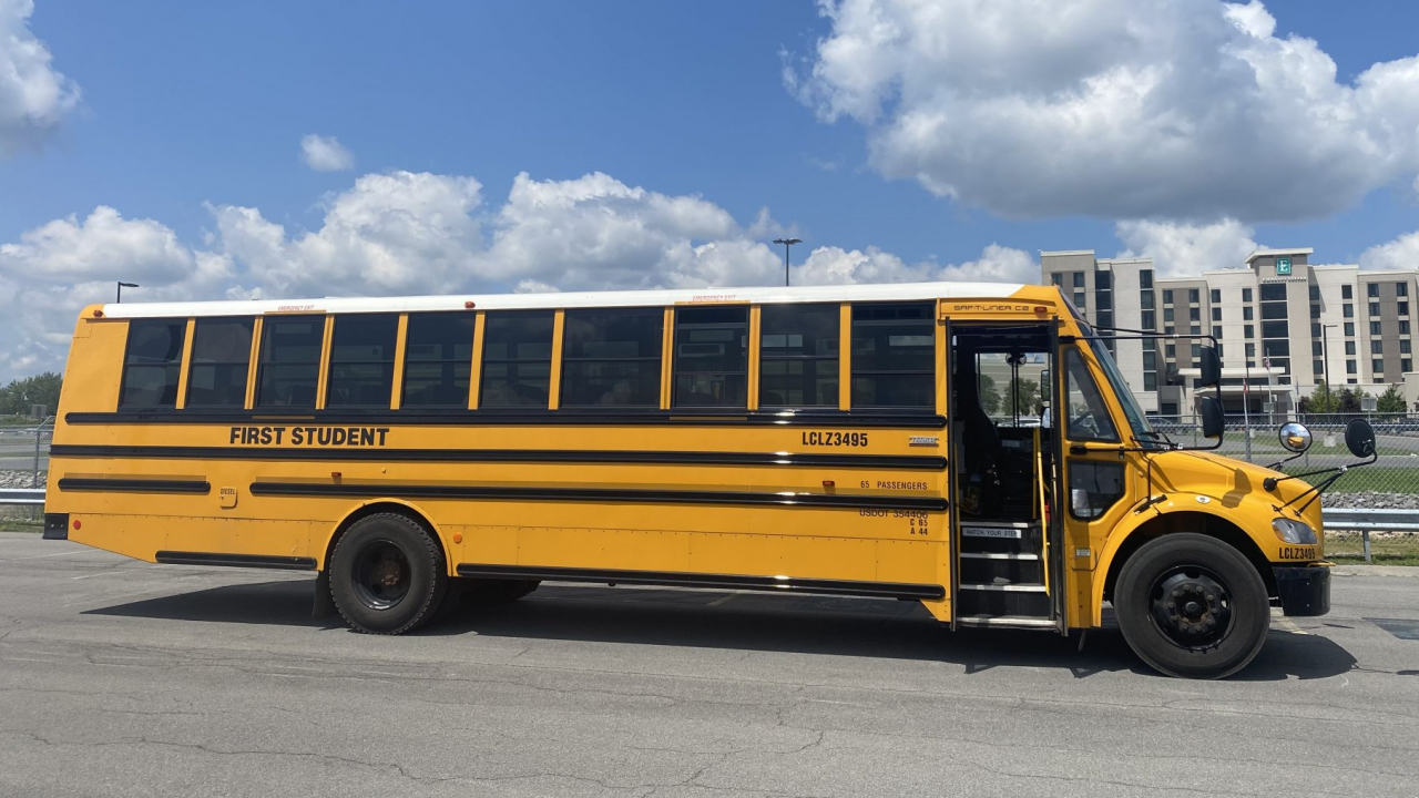 A yellow school bus sitting in the parking lot