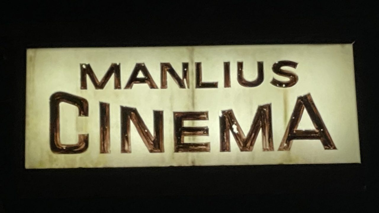 White sign of Manlius Cinema