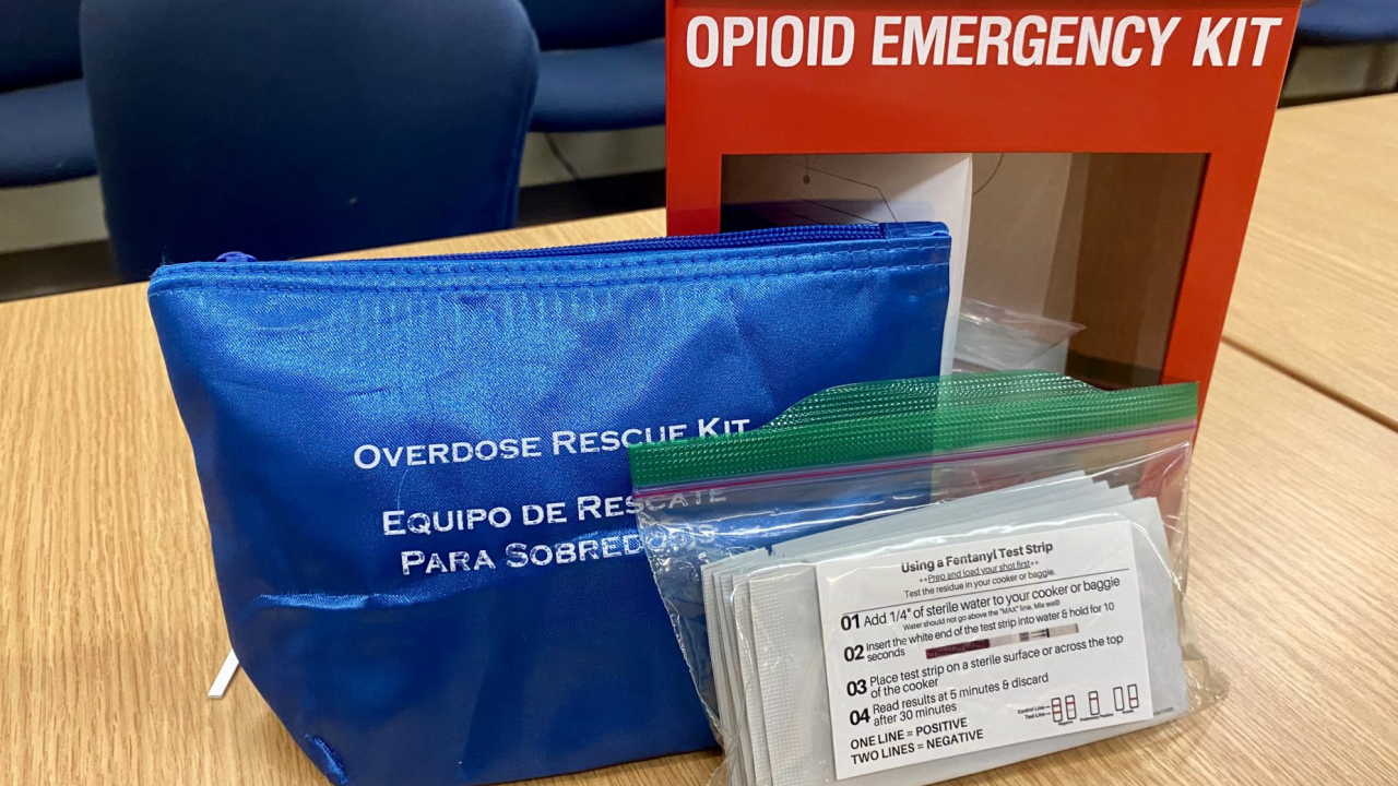 Opioid Emergency kit, Narcan kit with instructions, and fentanyl testing strips.