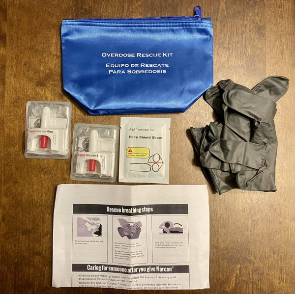 oxone training and Opioid Emergency Kits that contain gloves, a face shield, two doses of Narcan, and instructions for how to administer Narcan.