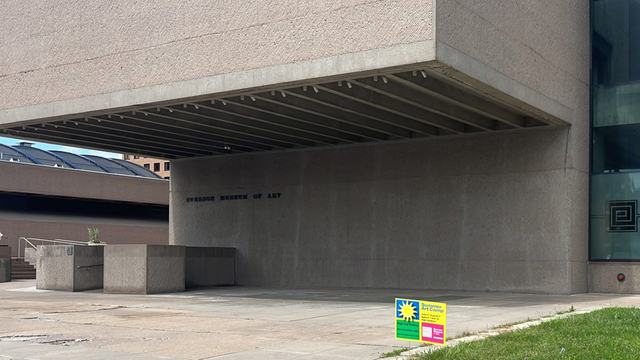 Everson Museum of Art and a sign advertising the camp