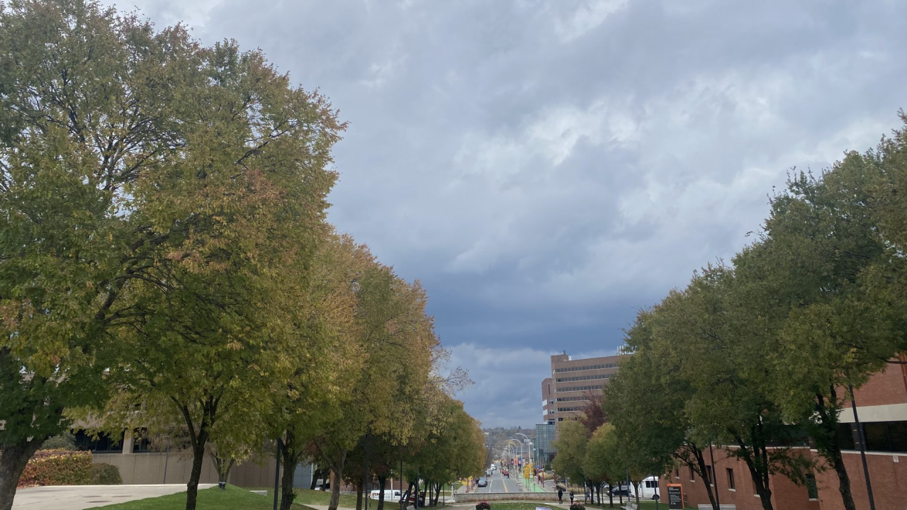 A cloudy sky looking out onto University Avenue in Syracuse.