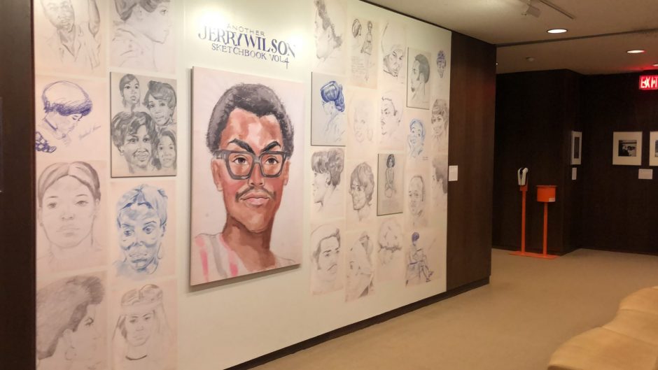 Exhibition wall of sketches by Jerry Wilson