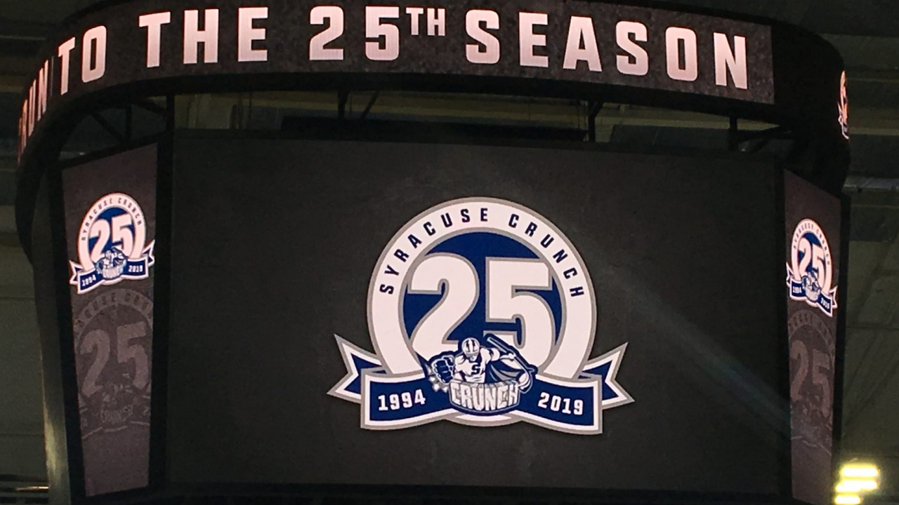 A video board with the Syracuse Crunch 25th year logo