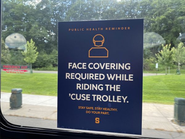 A sign in all Syracuse trolly's.