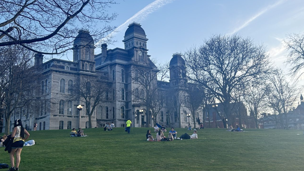 The Syracuse Quad and Hall of Languages during sunset hours.