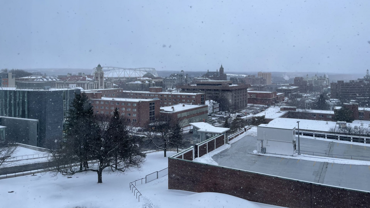 Flurries in the sky over Syracuse University Campus