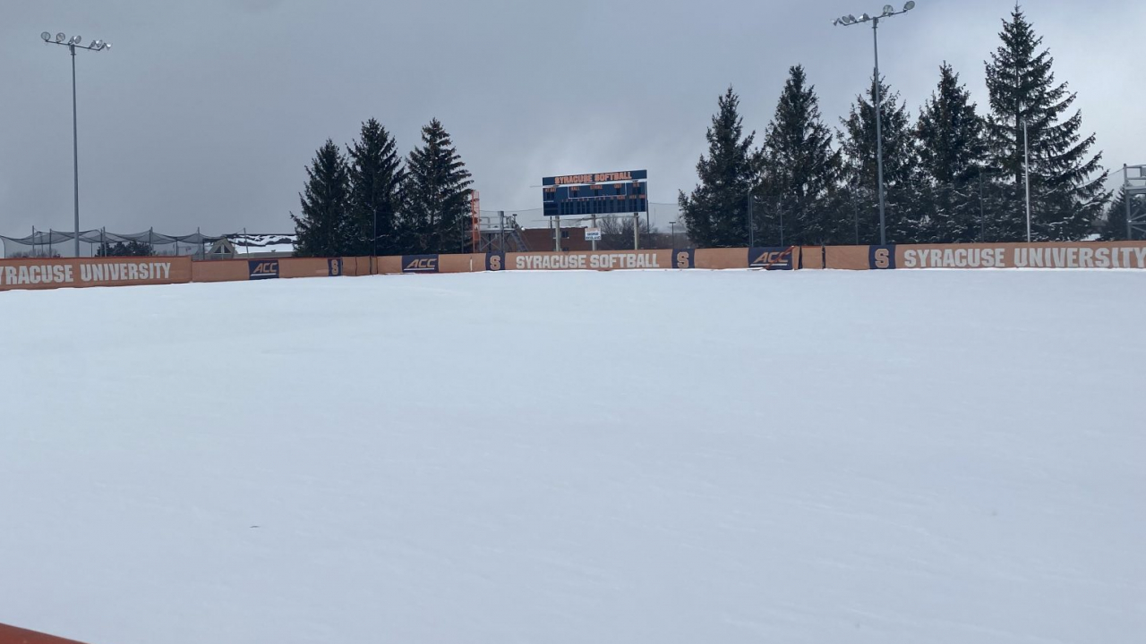 A softball field covered in snow