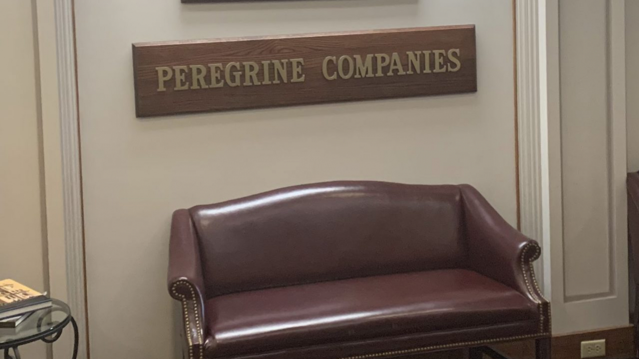 A sign showing Peregrine Senior Living.