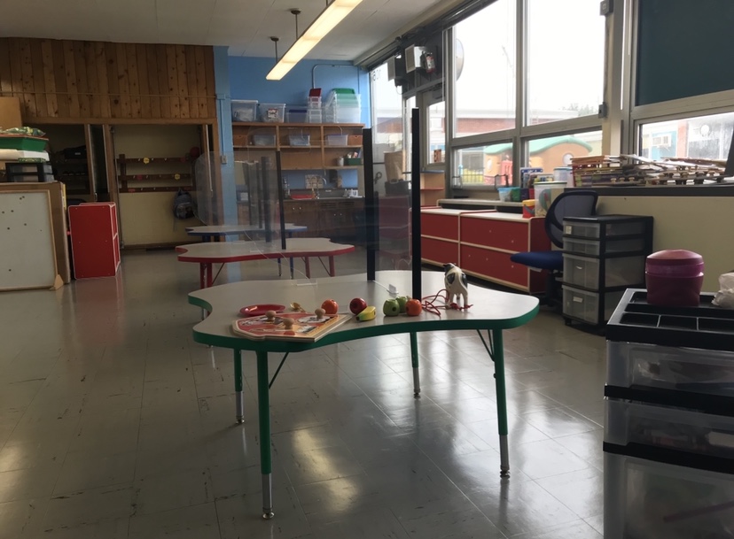 Table with toys on it in school classroom.
