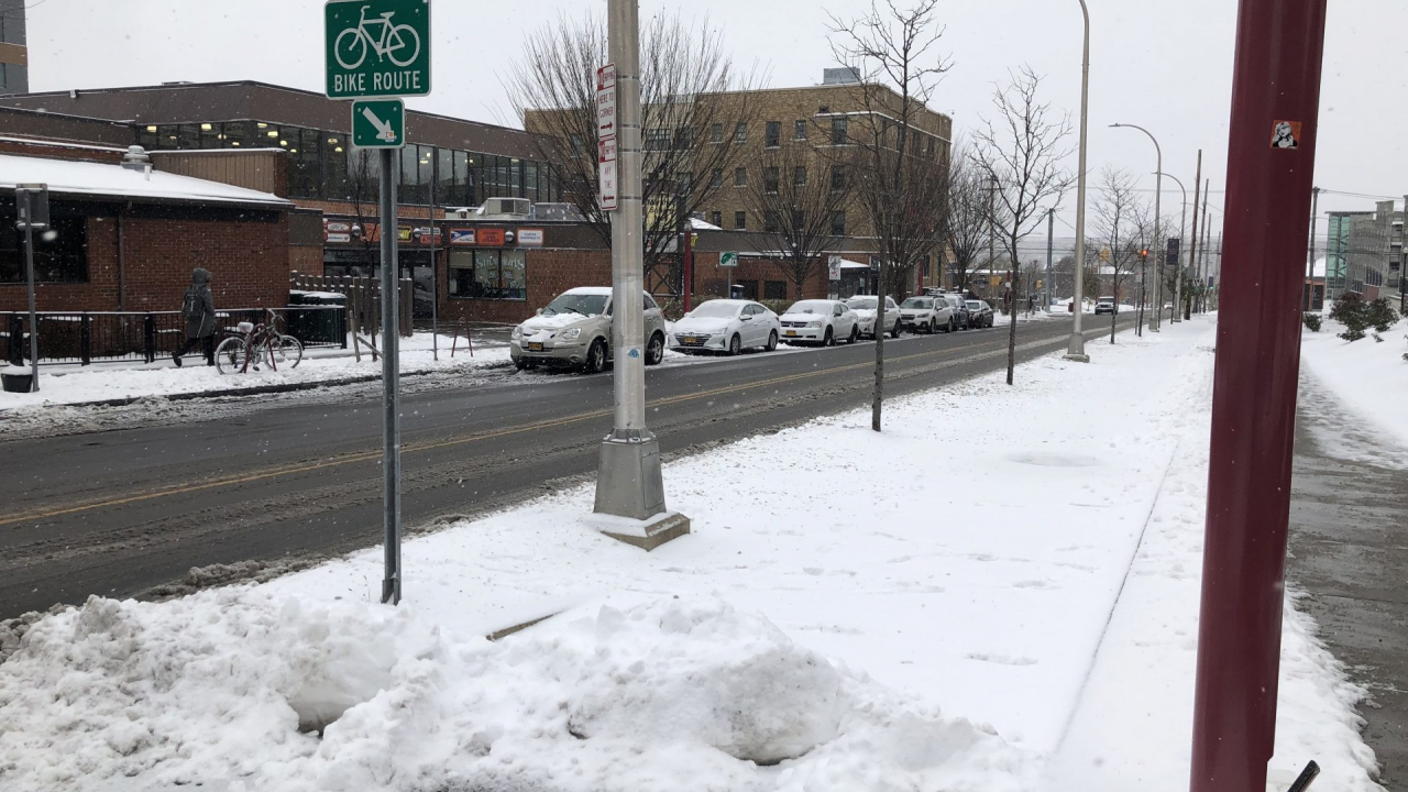 Picture of bike lane blocked by snow.