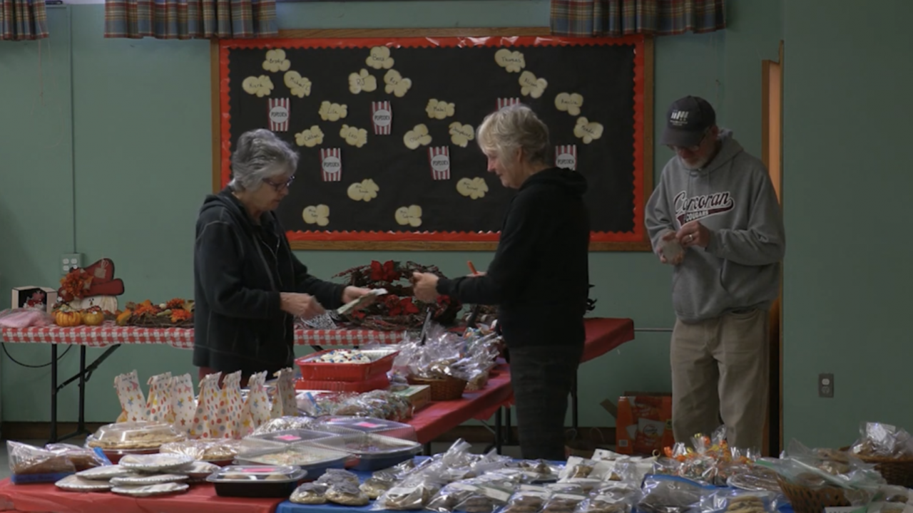 Gretchen and Chris Kinnell volunteer at the Bellevue Heights bake sale