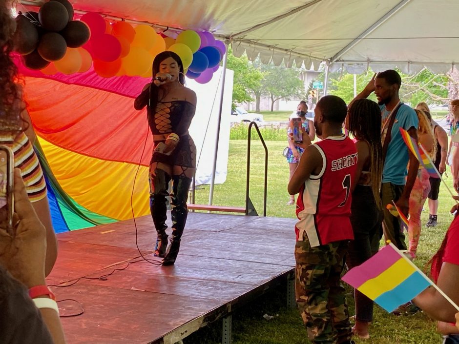 A rapper performing on stage at the Soul of Pride Cookout.