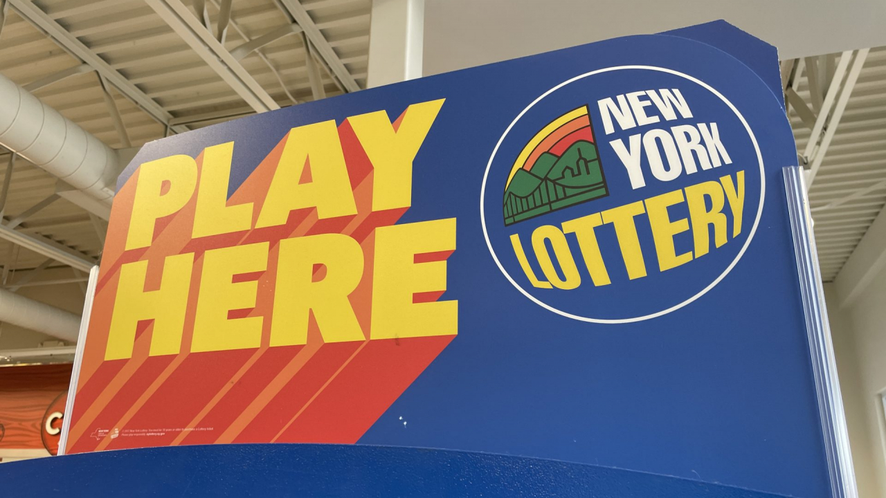 New York Lottery "Play Here" Sign