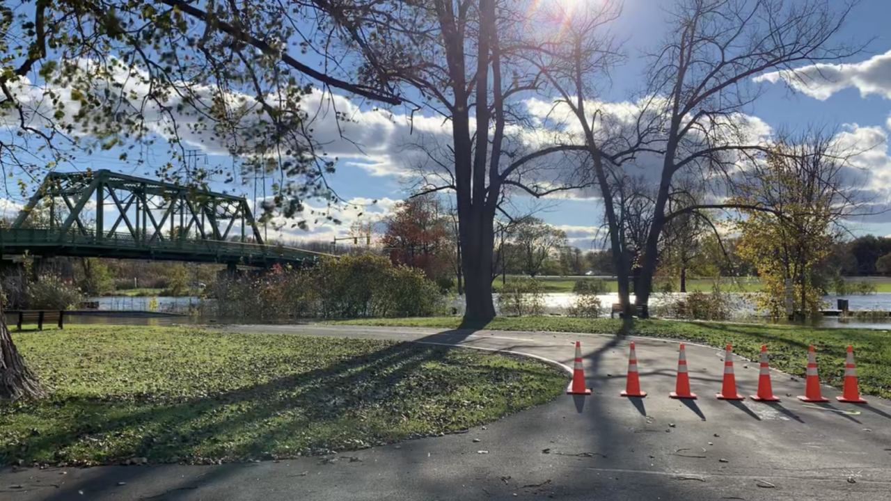 A closed road by Onondaga Lake, blocked by traffic cones.