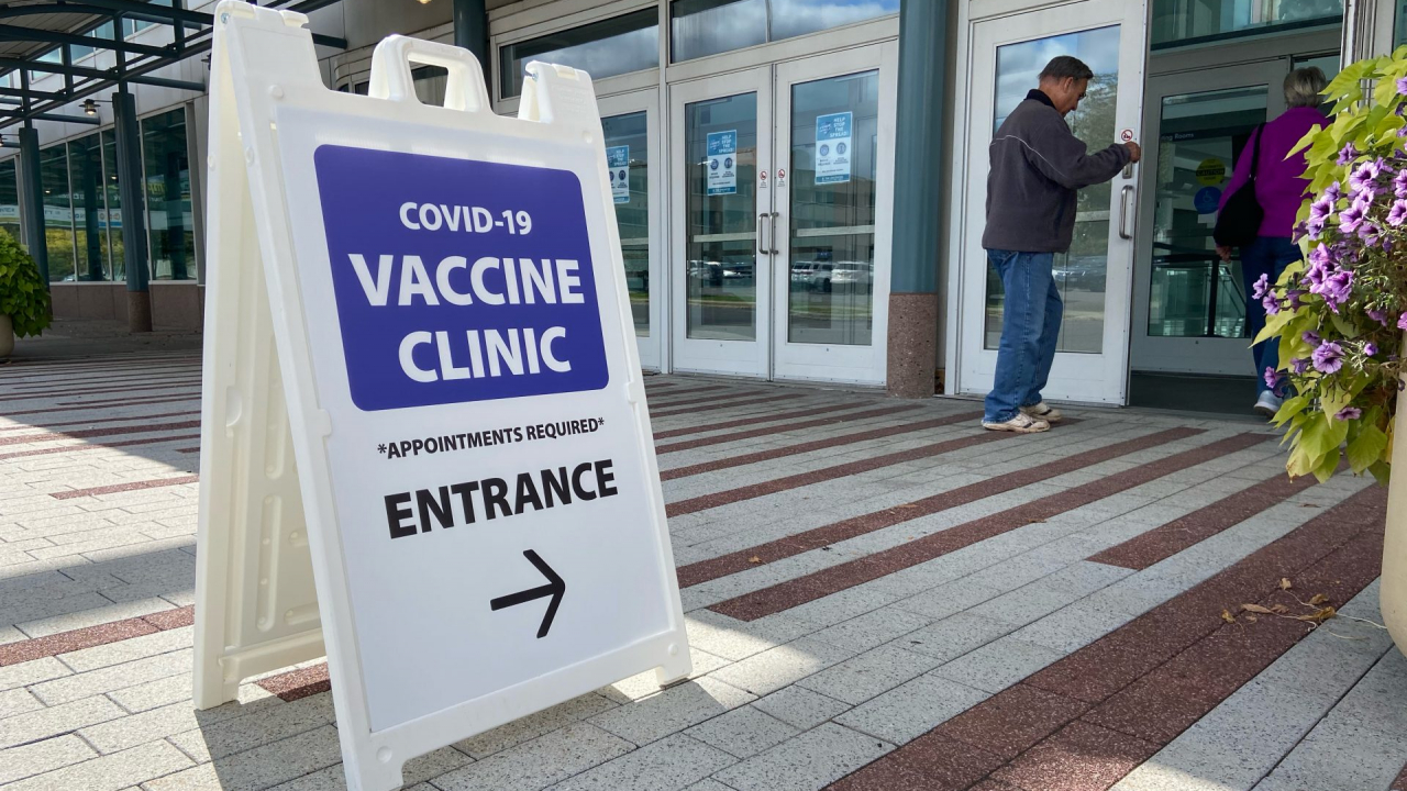 A man and his wife walk into the OnCenter for their Pfizer COVID-19 booster vaccine.