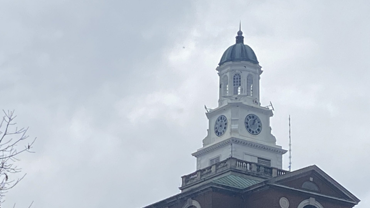 A clock tower amidst a cloudy sky