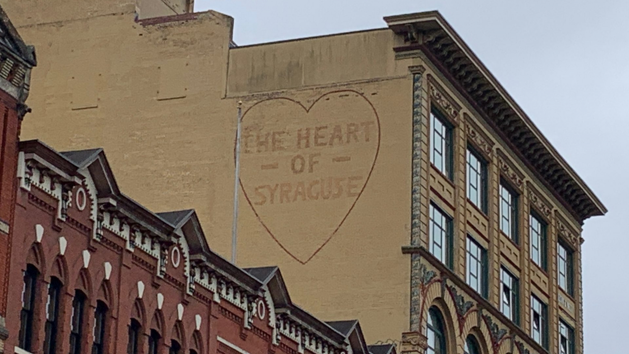 "The Heart of Syracuse" on the side of a building
