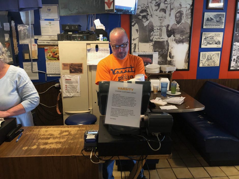 Eric Ockert stands at his register.
