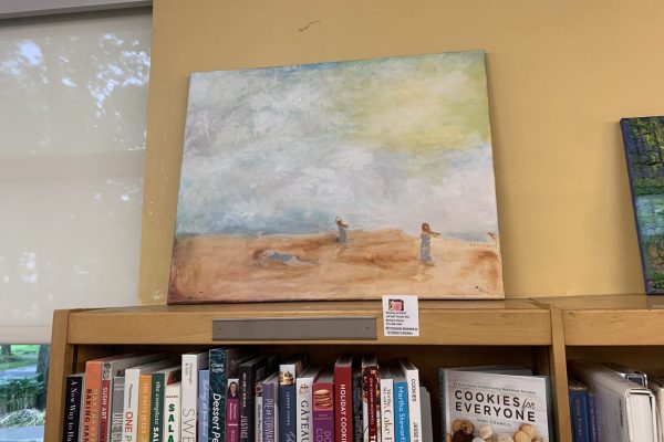painting of women on beach in library