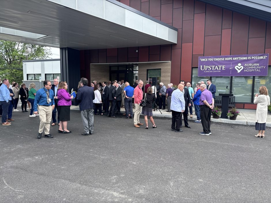 Public officials, doctors and others gather for the opening of the center