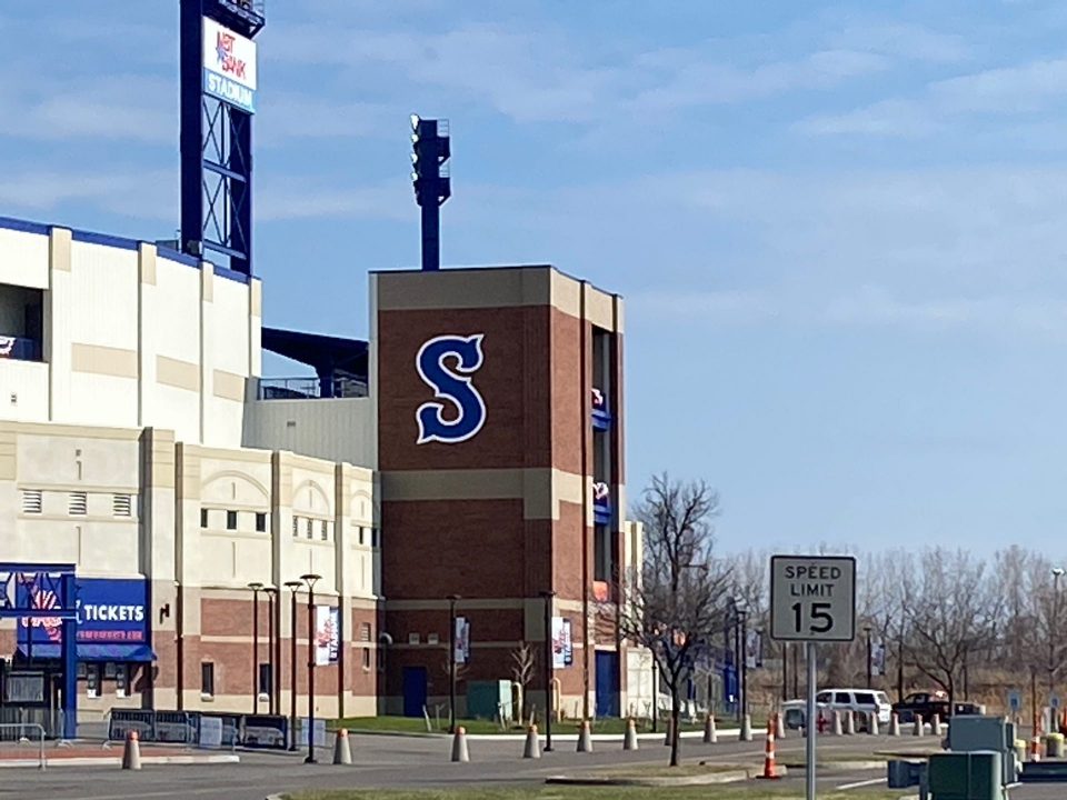 NBT Bank Stadium with a Syracuse Mets logo on a sunny day.