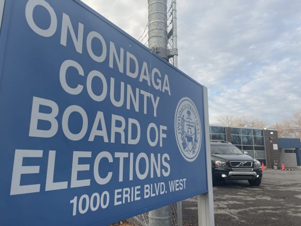 A sign reads, "Onondaga County Board of Elections."